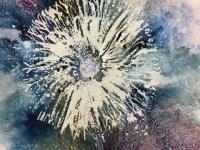 White dandelion clock amidst blue and mauves