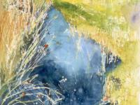 Bright blue water with reeds and trees Wicken Fen