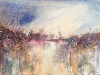 Mauve distant bank with reeds in the foreground