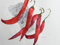 Five red chillies against a collaged label