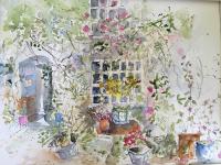 Rambling flowers, urns around an old house bathed in high summer sunshine.