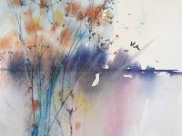 Blue pink background glimpsed through tall russet coloured reeds