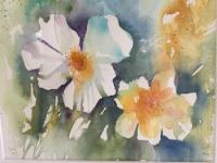 Two yellow and pink liliessurrounded by green/blue water