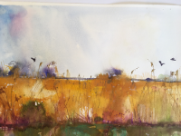 Yellow ochre reedbeds with birds and light blue sky