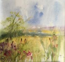 Yellow field with tree beyond. Bank of wild flowers in right corner