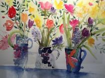 Three collaged jugs containing daffs, tulips and hyacinths