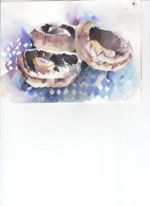 Three mushrooms on a blue gingham cloth