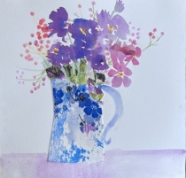 Pink and mauve flowers in a blue patterned vase