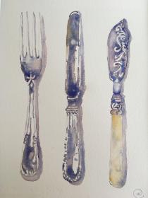 Silver fork and knofe plus ornatelt decorated knifeon plain background